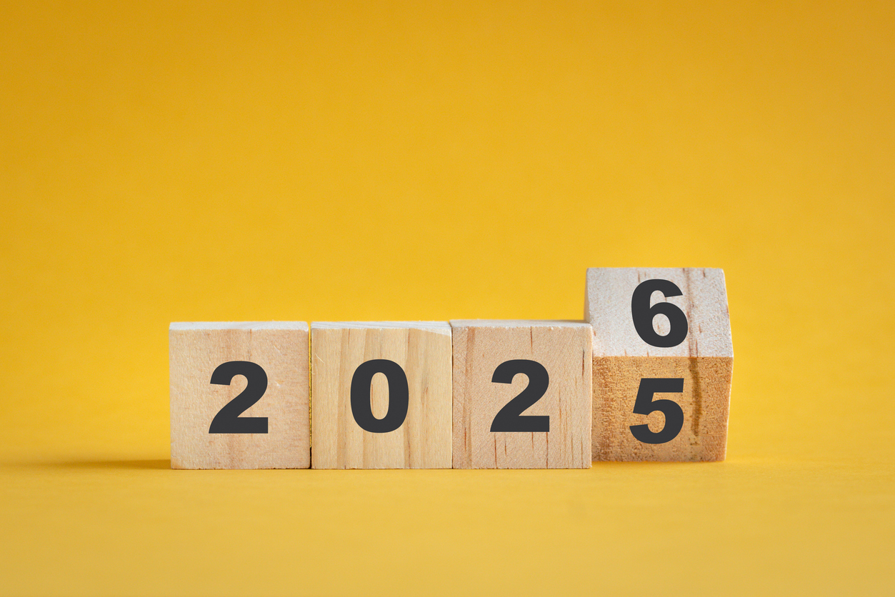 2025 turn to 2026, square blocks isolated on yellow surface.